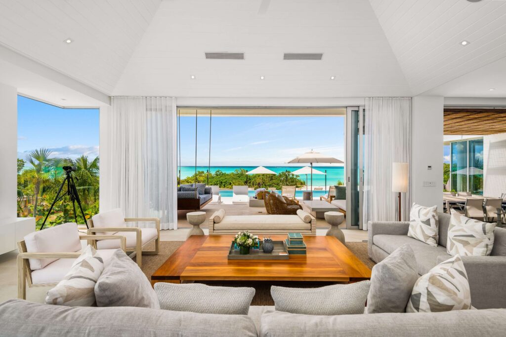 Views across a pool and the Caribbean Sea from one of the suites at Beach Enclave