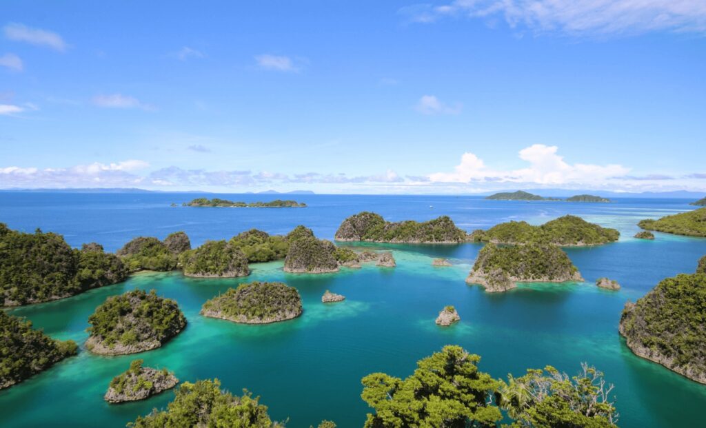 An aerial view of islands in Raja Ampat - home to some of the best eco-dive resorts in Southeast Asia