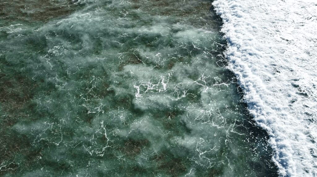 Best eco-hotels in Portugal for surfers: An elevated view of a surf break in Portugal