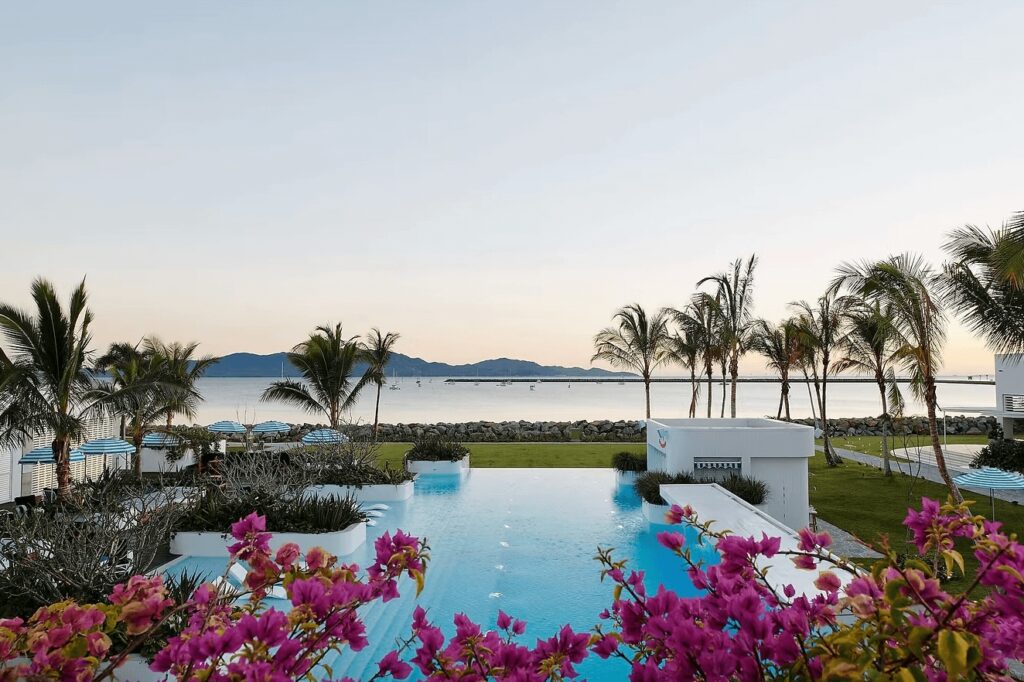 The waterfront pool at The Ville Resort in Townsville, the best place to stay for diving the Yongala Wreck
