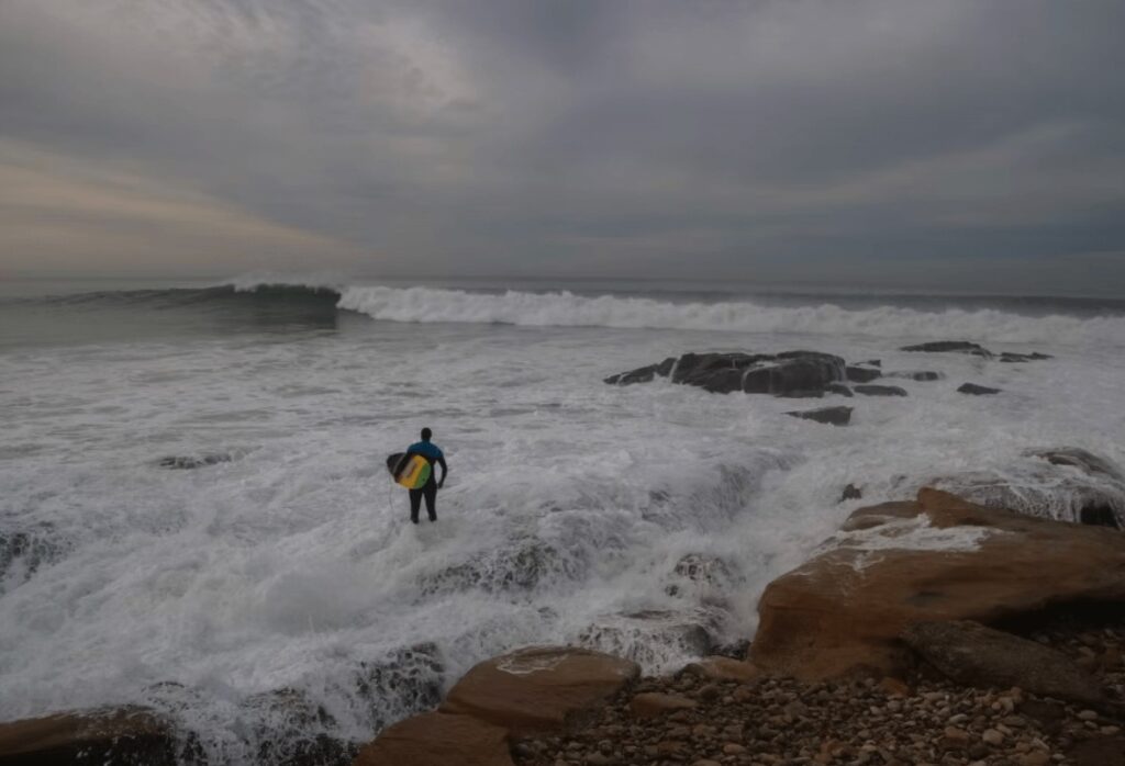 A surfer looks out toward Anchor Point in Morocco, one of the world's best surf destinations