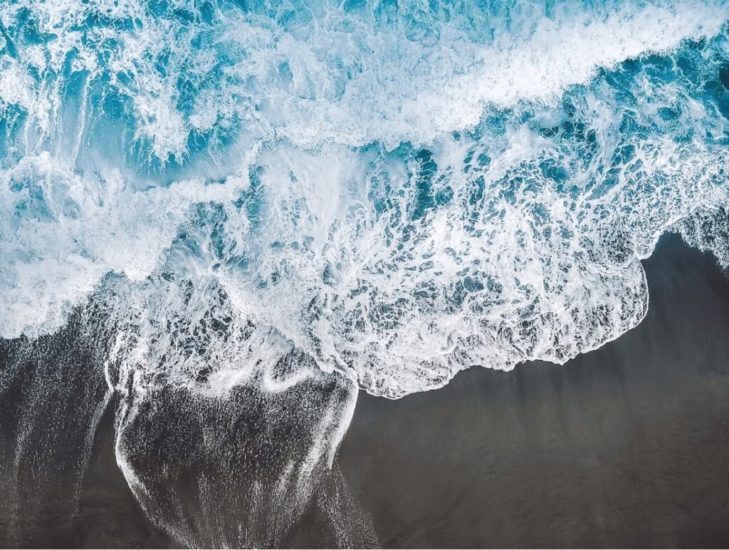 Waves lap a black sand beach on Colombia's Pacific coastline