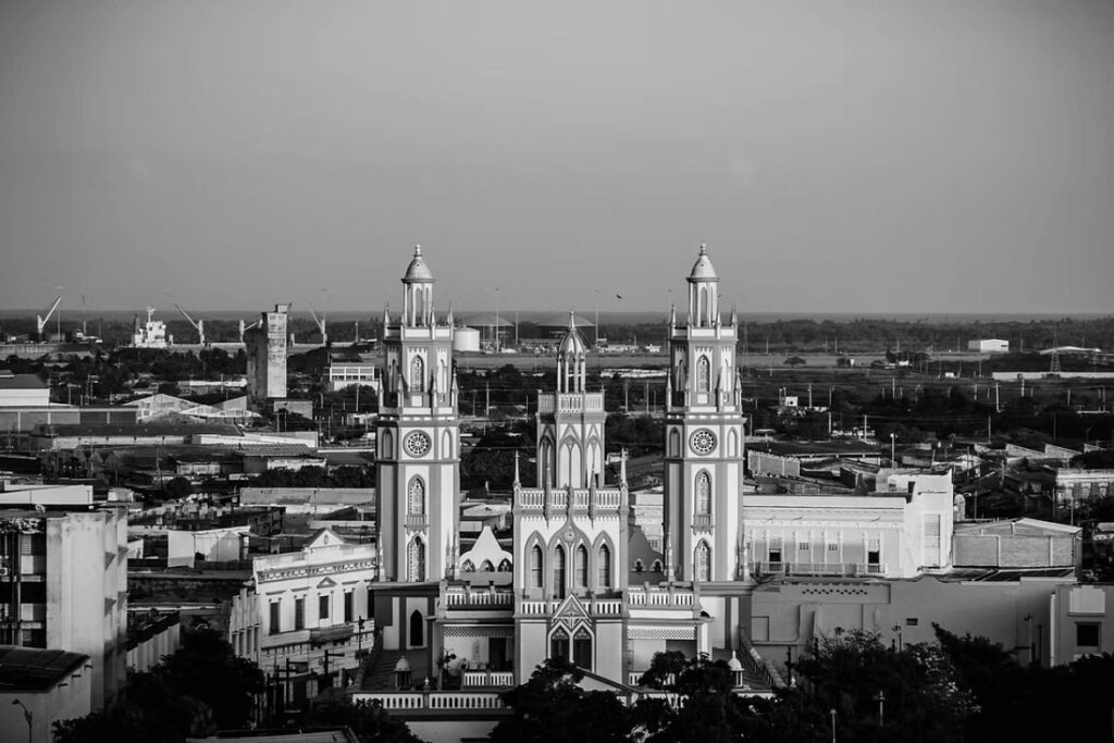 A magnificent church dominates a city skyline in Colombia