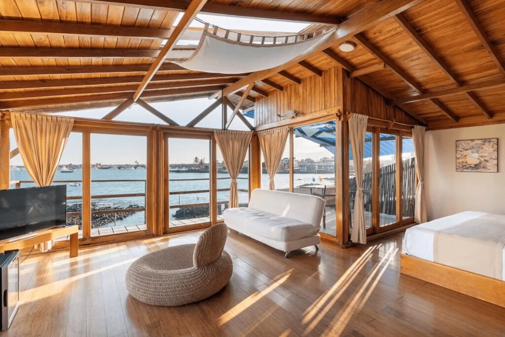 One of the luxurious suites at Kandolhu Maldives, a sustainable dive resort in the Maldives 