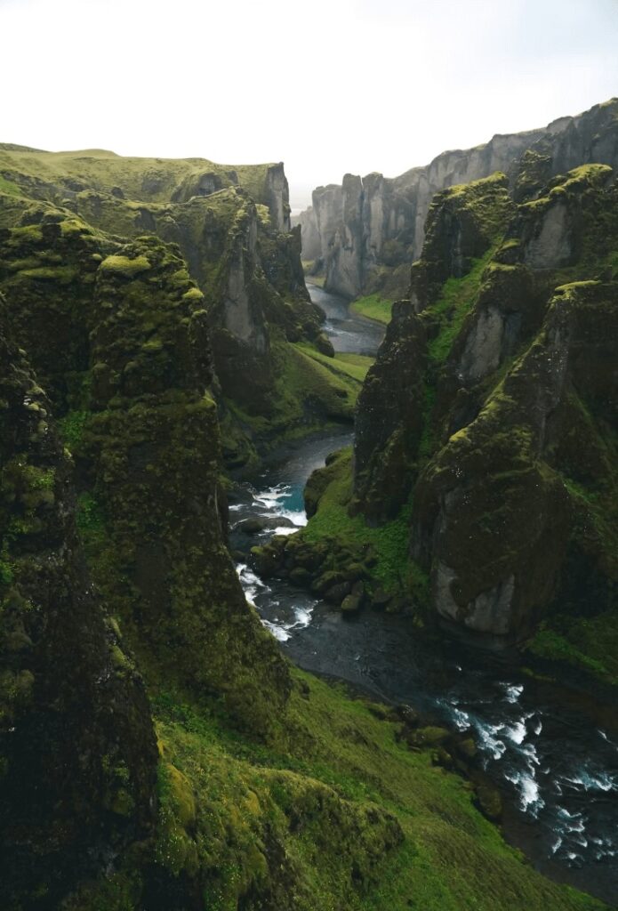 Best surfing in Iceland: Dramatic cliffs frame a river in Iceland