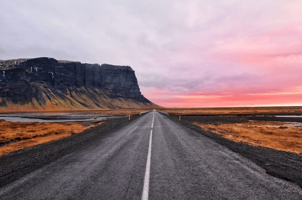 Sunset illuminates the sky during a surf trip to Iceland