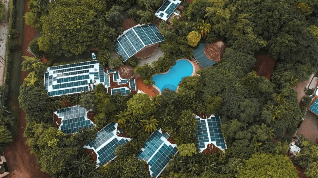 An aerial view of solar panels on the roof of Cala Luna Boutique Resort, an eco-friendly hotel in Tamarindo