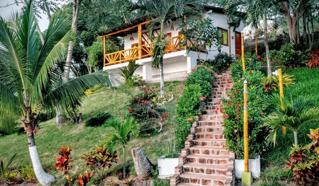 A steep staircase leads to a sustainable bungalow at Nativa Bambu Ecolodge in Montañita