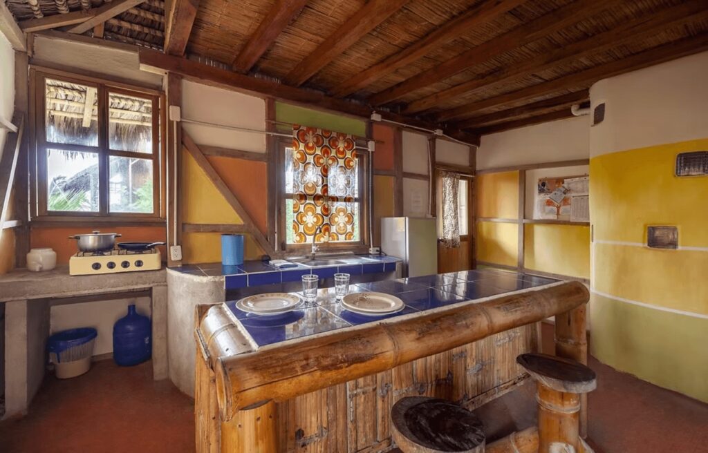 One of the colourfully decorated rooms at La Casa Mompiche, one of the best eco-friendly hotels in Ecuador