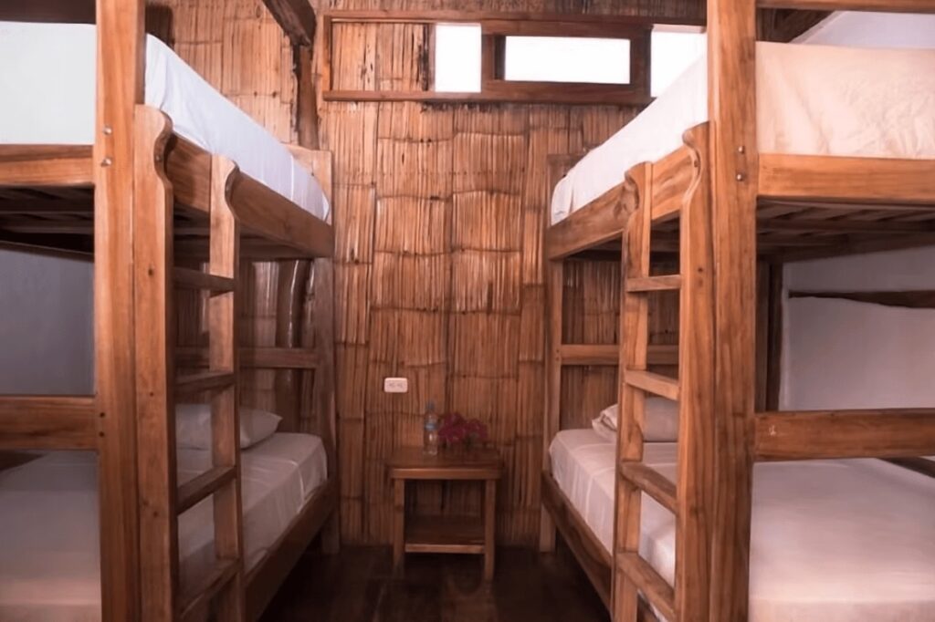 A shared dormitory at Hostal Rutamar, an eco-friendly hotel in Canoa, Ecuador