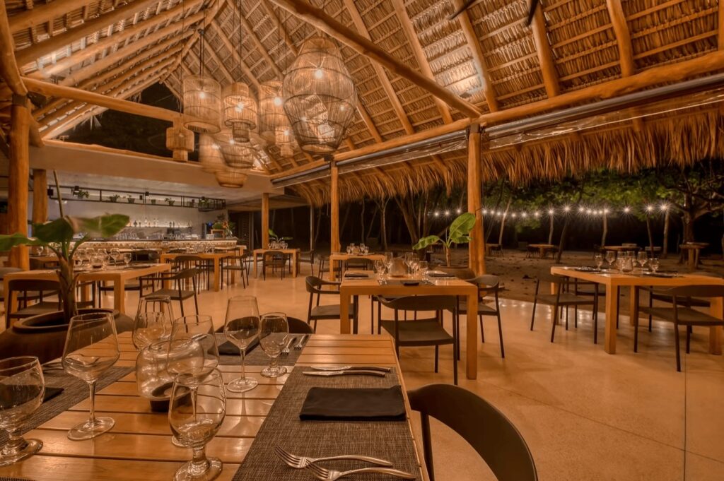 The inviting dining space at Hotel Nantipa, an eco-friendly hotel in Santa Teresa 