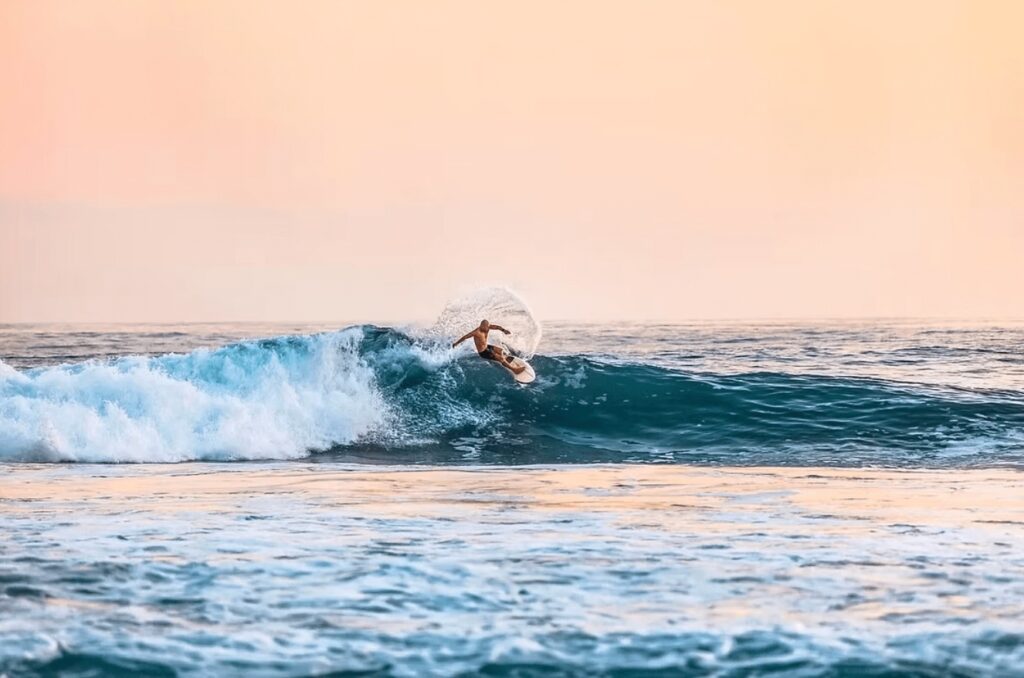 A surfer rides a wave in Nicaragua, one of the best places to surf in Central America