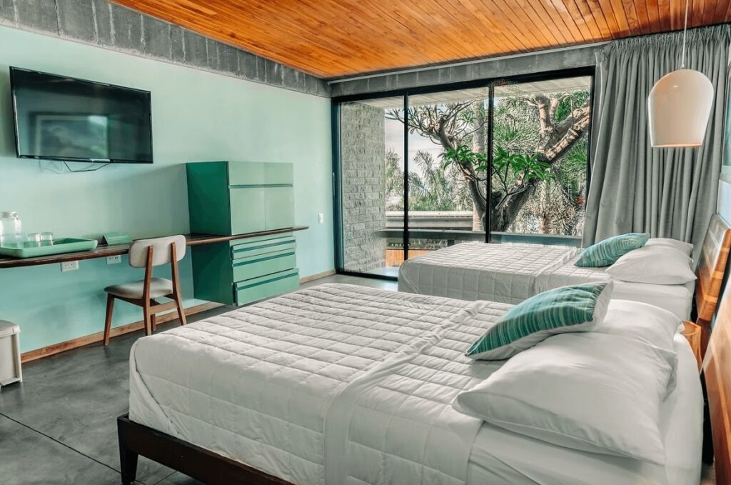 A mint-coloured room at the Puro Surf Hotel, a highly-rated eco-resort in El Salvador 