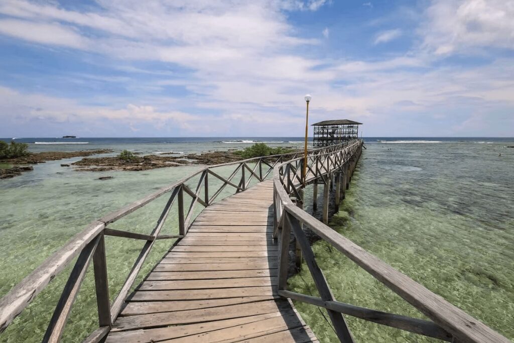 Eco-hotels in Siargao: A wooden boardwalk leads to the viewing platform at "Cloud 9"