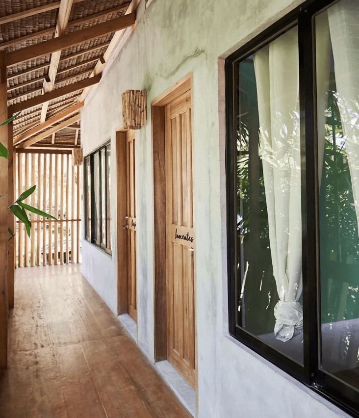 Doors leading into the eco-friendly rooms at Diwa Siargao
