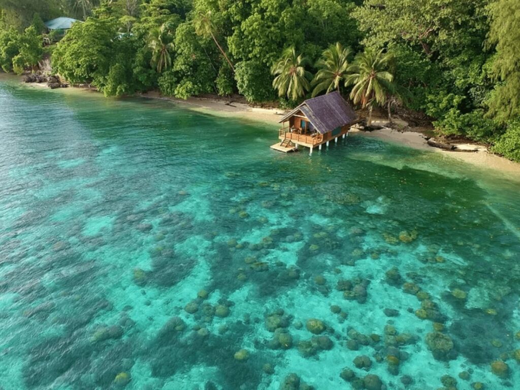 An overwater bungalow at Fatboy's Resort on Mbambanga Island - one of the best surf resorts in the Solomon Islands 