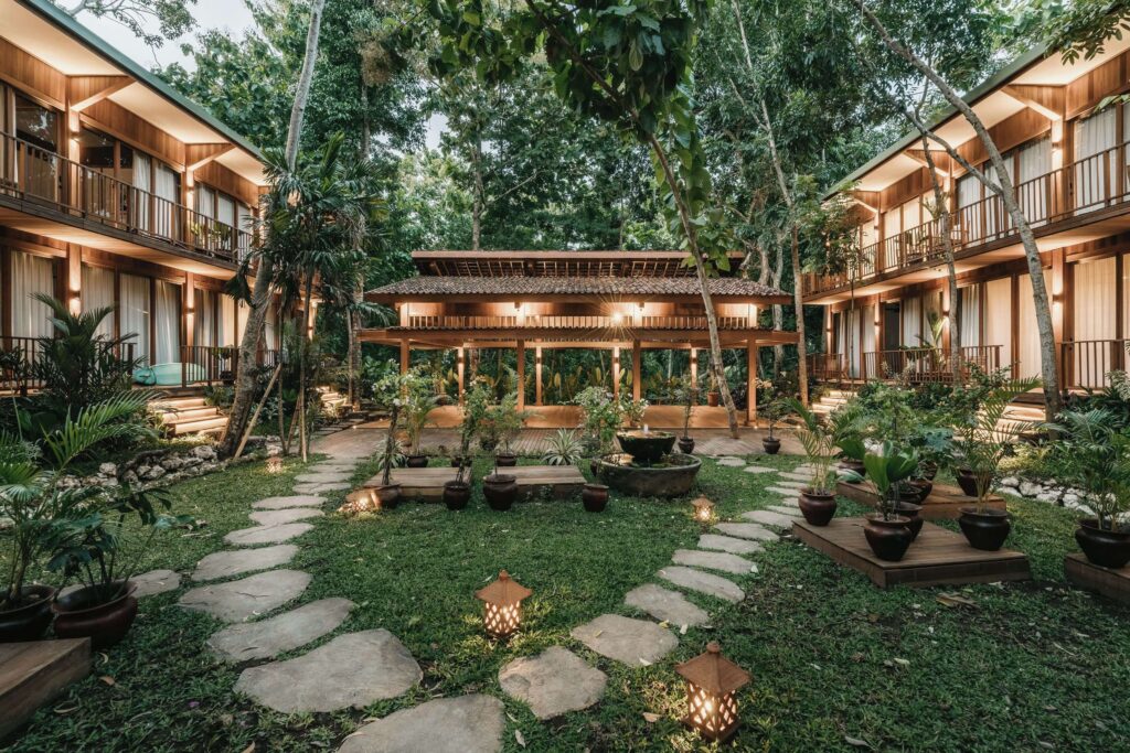 Stepping stones lead between the architecturally impressive rooms at Grün Resort in Uluwatu
