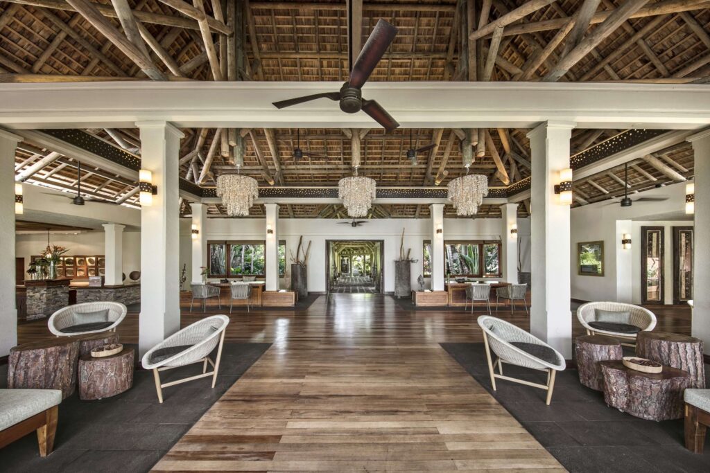 The inviting lobby at Heritage Awali Golf & Spa Resort - a sustainable hotel in Mauritius