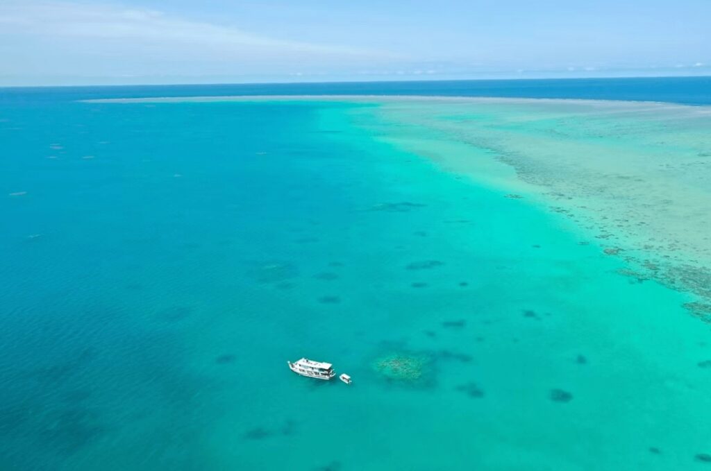An aerial view of a dive boat on the Great Barrier Reef, Queensland