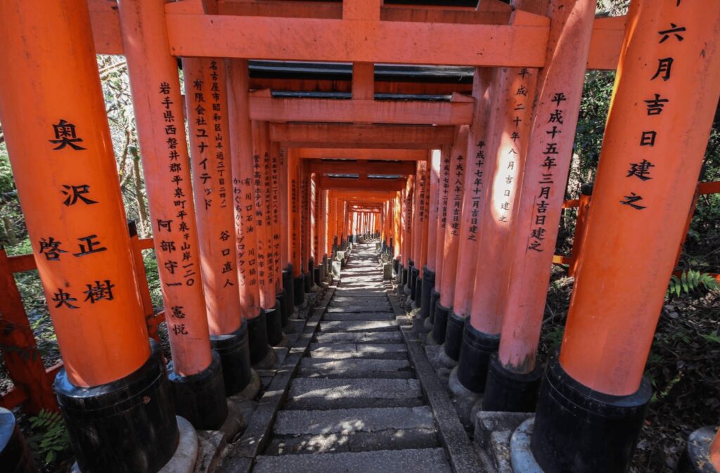 Red torii gates lead to a temple in Japan