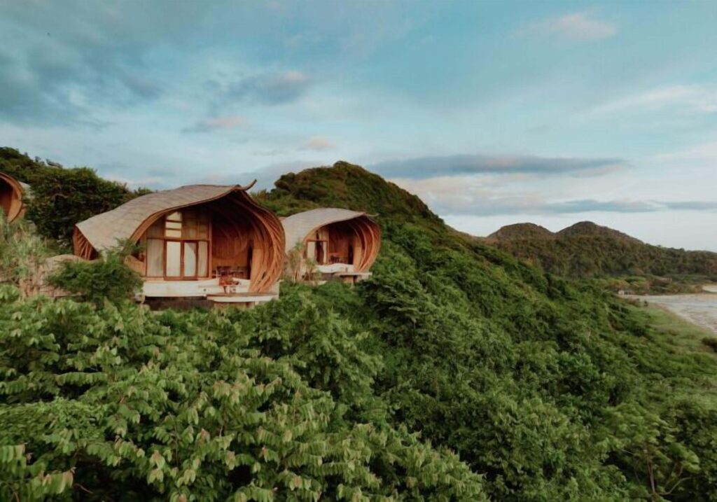 Bamboo bungalows overlooking the beach at Kini Resort in Sumbawa