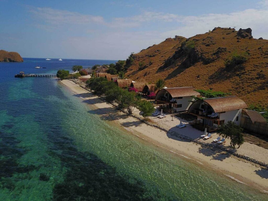 Bungalows overlooking the beach at the eco-friendly Komodo Resort