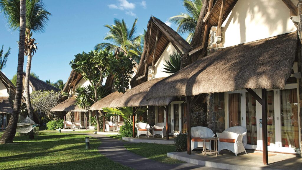 Thatched roof bungalows at La Pirogue - a sustainable hotel in Mauritius