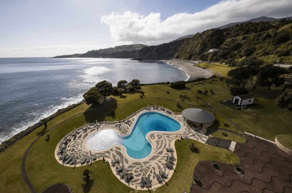 An elevated view of the oceanfront pool at Pestana Bahia Praia Nature & Beach Resort in the Azores Islands 