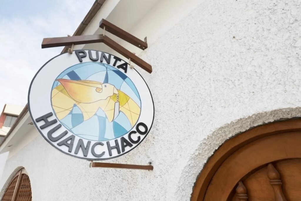 The sign for Punta Huanchaco - a budget-friendly hostel for surfers in Huanchaco