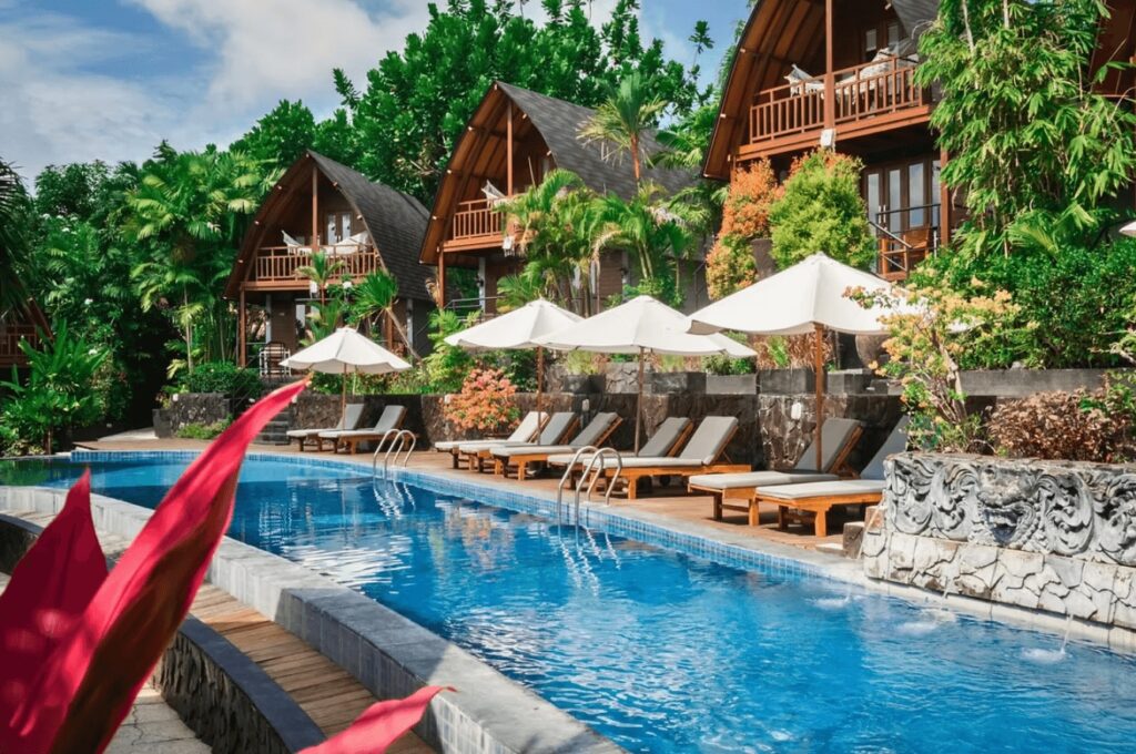 Bungalows back a swimming pool at S-Resorts Hidden Valley in Bali 