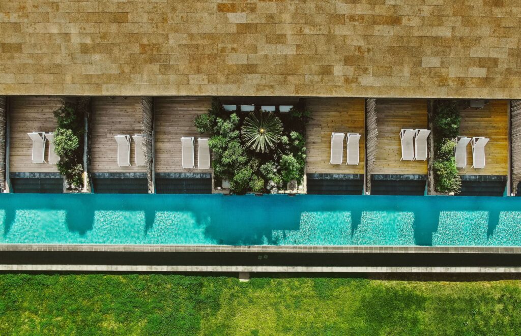 A bird's eye view of the elongated swimming pool at Santa Barbara Eco-Beach Resort