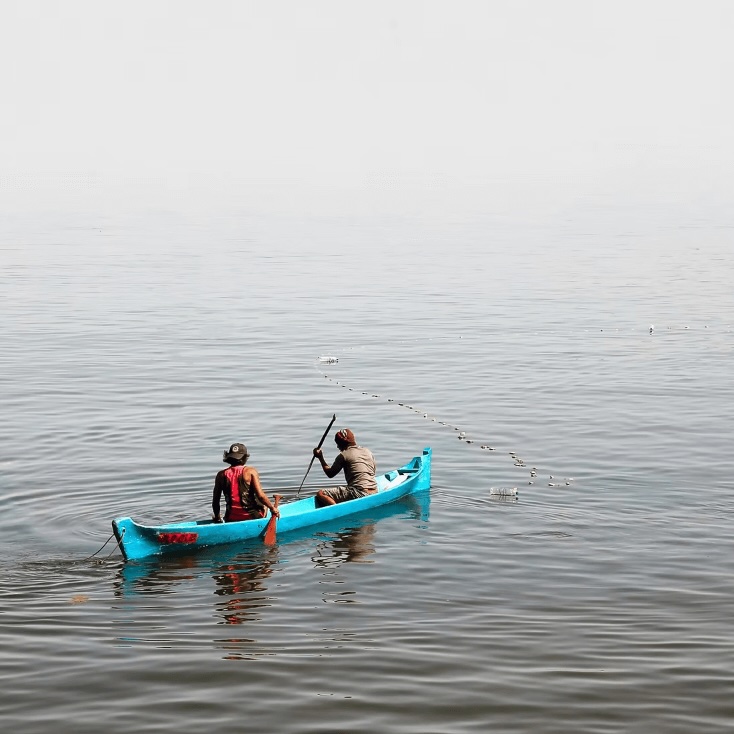 Best diving in Timor Leste: East Timorese fishermen in a blue canoe