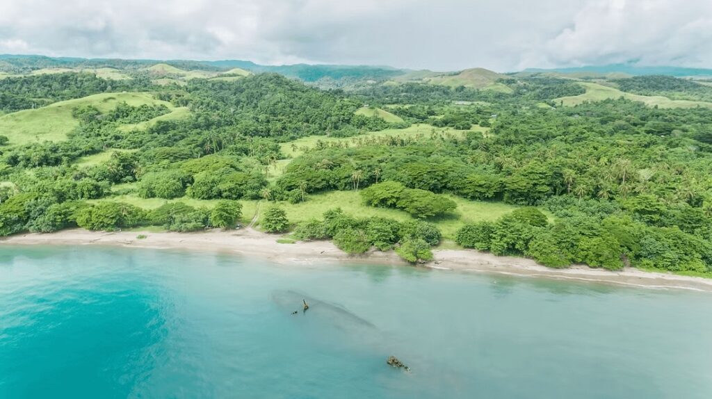 Surfing the Solomon Islands: A shipwreck submerged off the coast of Melanesia