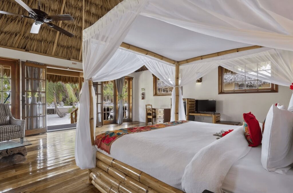 A beautifully decorated suite at Portofino Beach Resort, one of the best dive resorts in Ambergris Caye