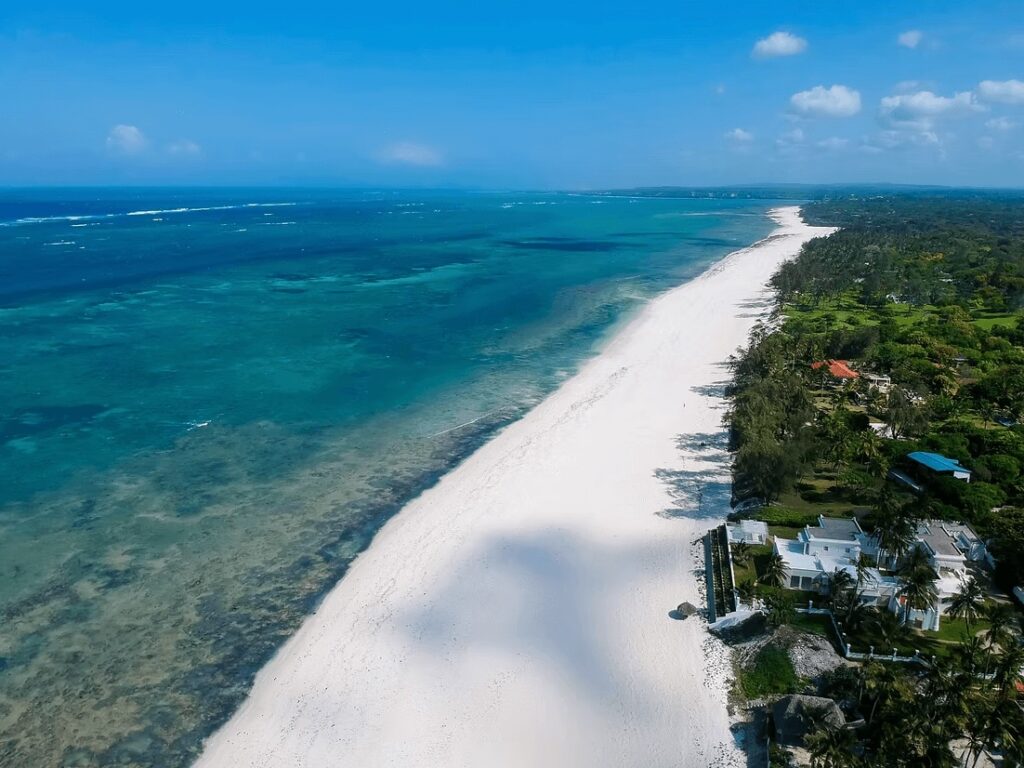Elevated views across the white sands of Kilifi and Distant Relatives near Mombasa 