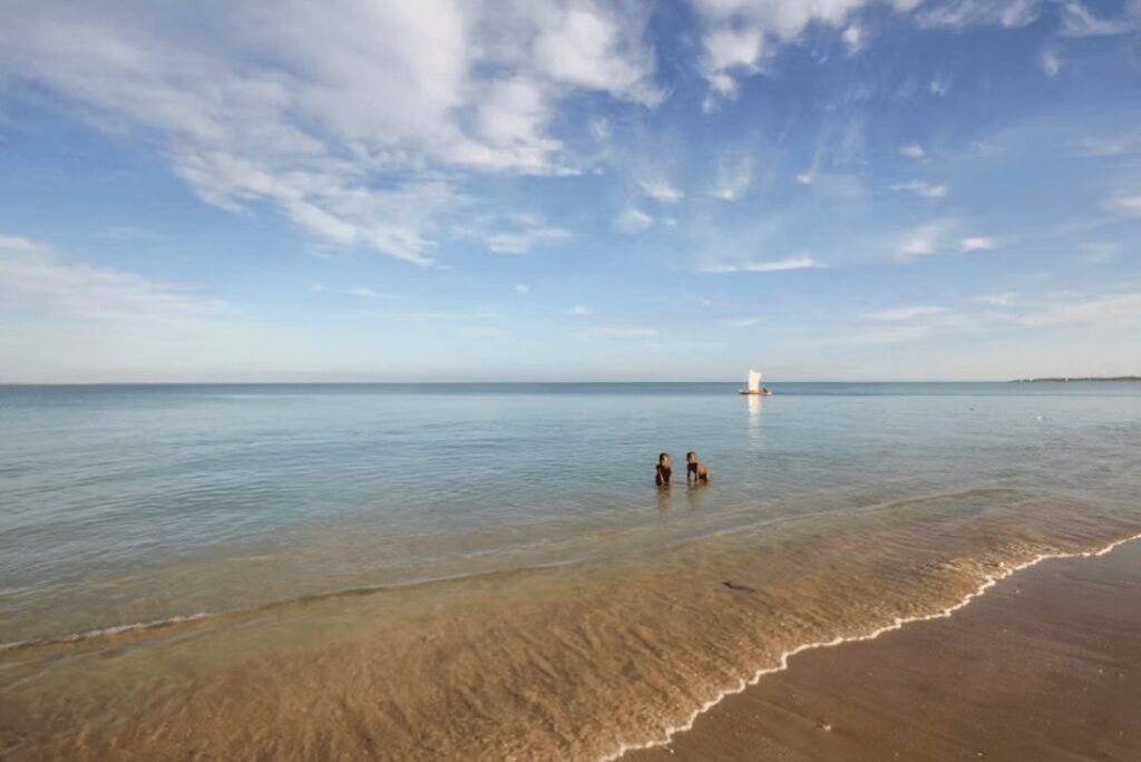 Scuba diving in Madagascar: Two young Malagasy boys play in shallow waters