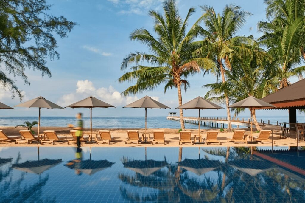 Sun loungers in front of the oceanside pool at The Boathouse Pulau Tioman 