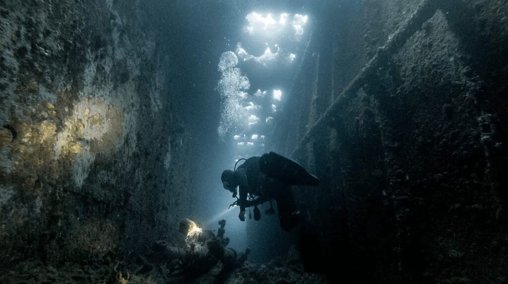 Scuba diving in Micronesia: A diver explores a World War II wreck in the Truk Lagoon