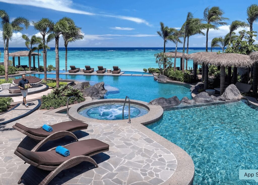 Sun loungers beside the oceanfront pool at Dusit Thani Guam Resort 