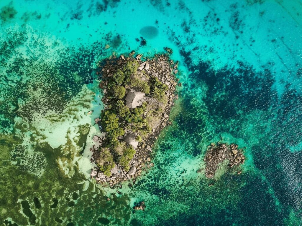 UNESCO dive sites: A bird's eye view of a rocky island in the Indian Ocean