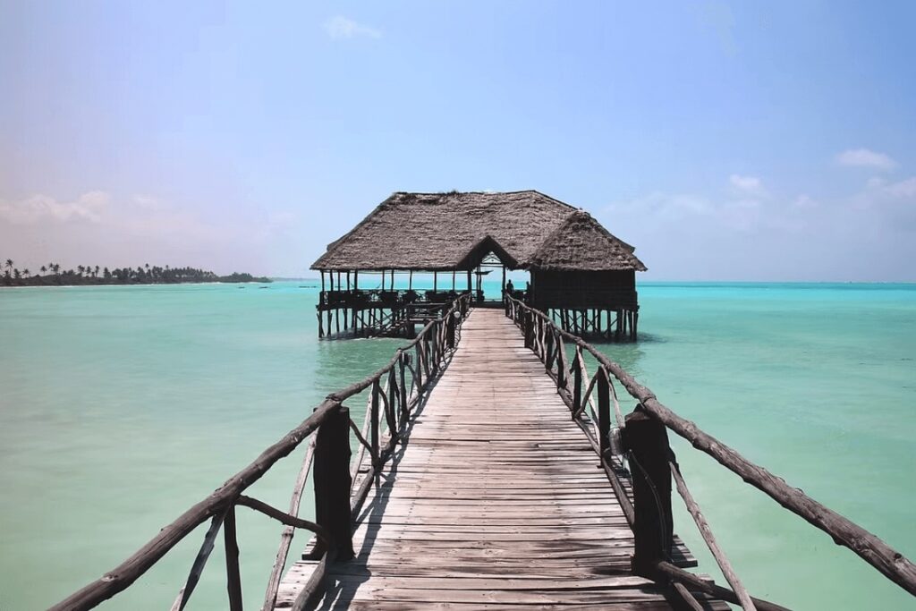 Scuba diving in Tanzania: A jetty extends into the water at an eco-friendly resort in Zanzibar