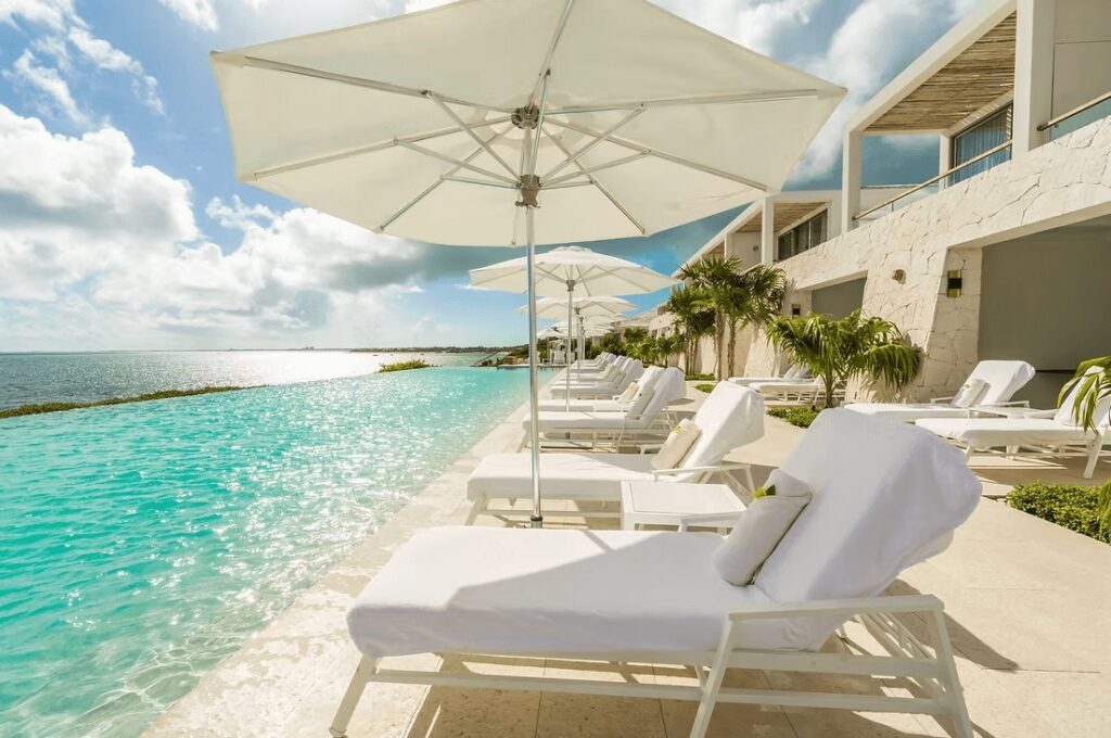 Sun loungers beside the spectacular infinity pool at the Rock House, an eco-hotel in Providenciales, Turks and Caicos