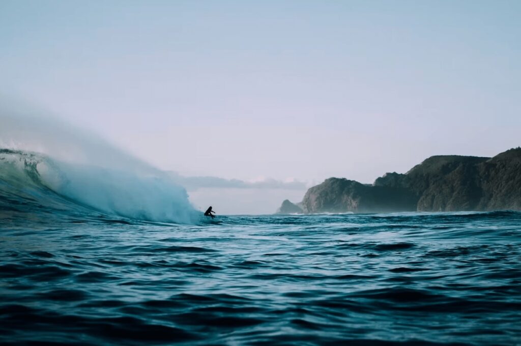 Seismic blasting: A surfer rides a wave off the southern coast of Australia