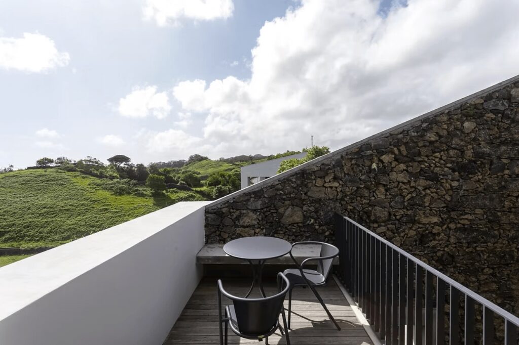 A sun-dappled terrace at Solar Branco Eco Estate, an eco-friendly hotel in Ponta Delgada 