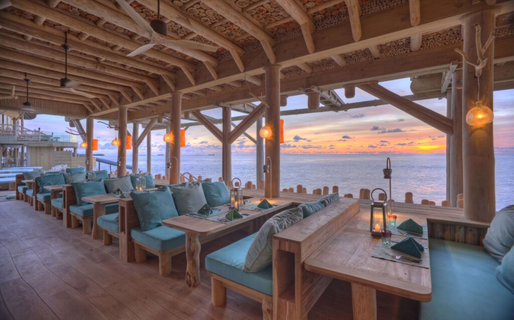 Sunset views from a waterfront lounge at Soneva Fushi in the Maldives