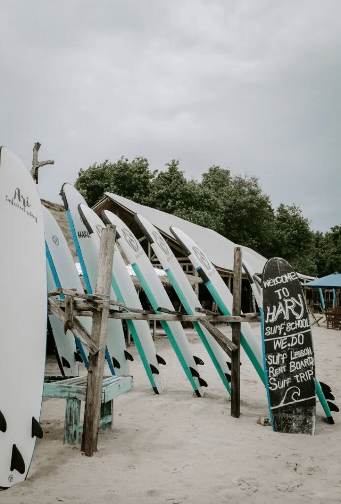 Foam surfboards for rent at one of the best places to learn to surf in Lombok