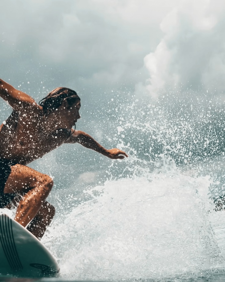 Surfing in Pohnpei, Micronesia: A surfer rides a wave in Pohnpei