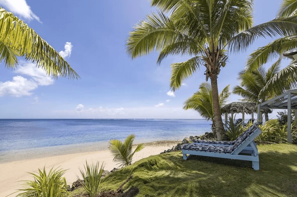 Sun loungers overlooking the beach at Savai'i Lagoon Resort, an eco-friendly hotel in Samoa 