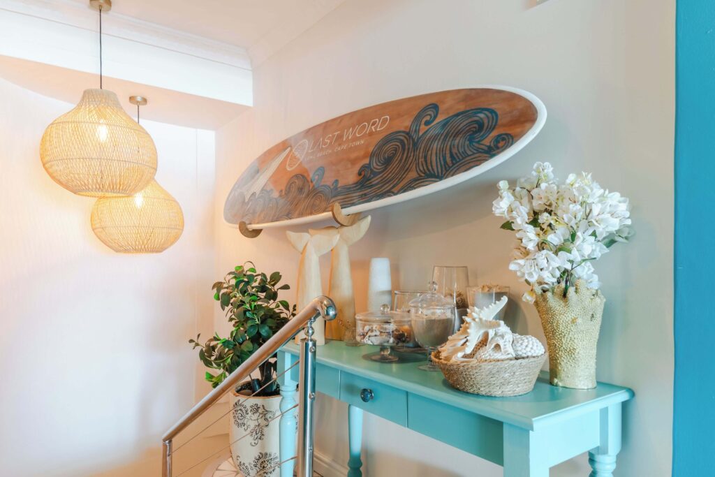 A surfboard on a wall at Last Word Long Beach, one of the best places to stay in Kommetjie for surfers