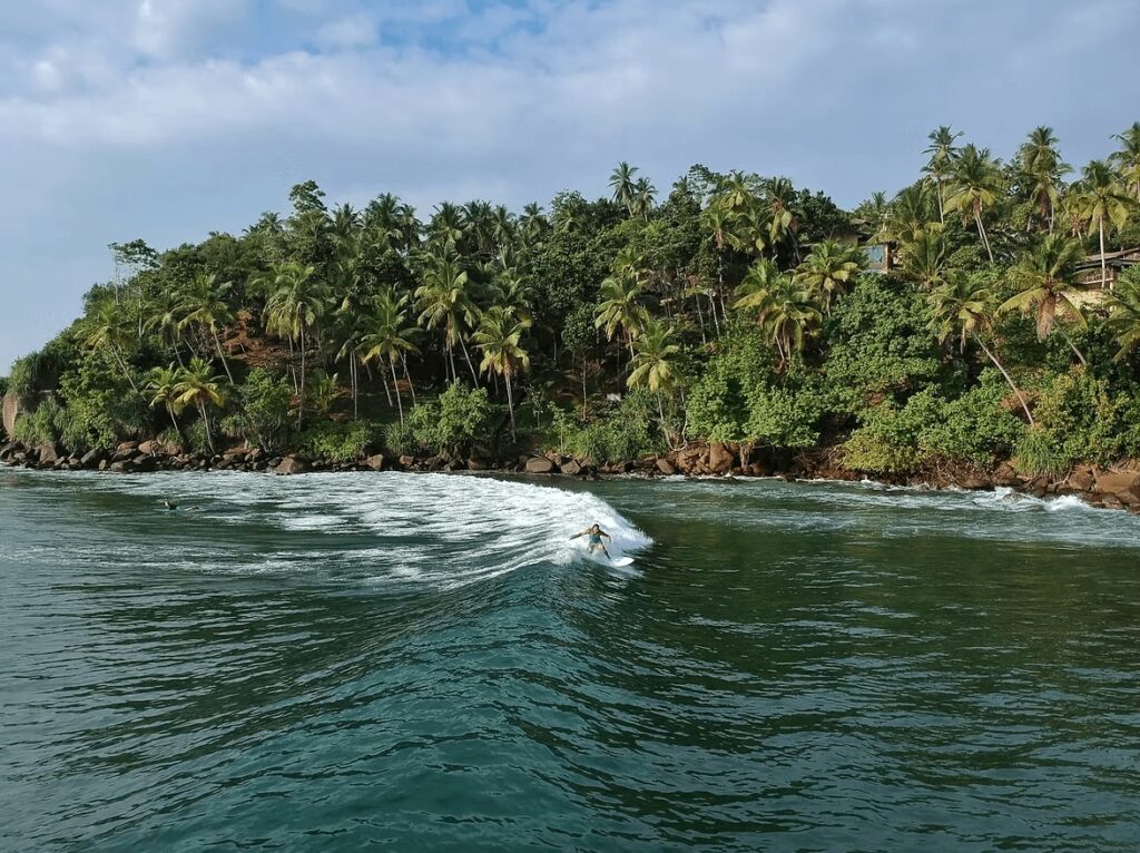 What is STOKE certification? A surfer rides a wave in Mirissa, Sri Lanka